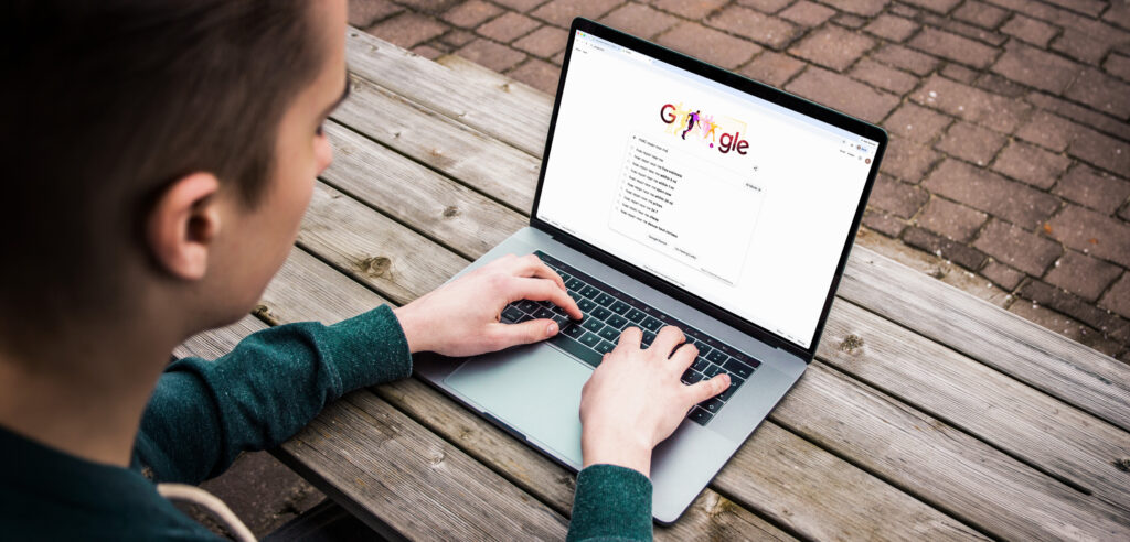 guy googling on laptop